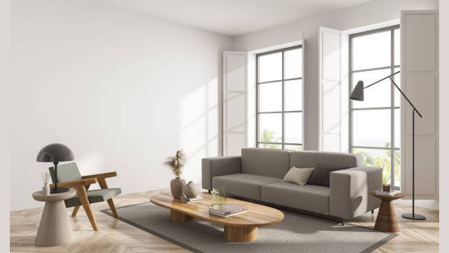 Lounge room interior with armchair and couch on carpet, wooden coffee table and window shutters with countryside, parquet floor. Copy space blank white wall, 3D rendering